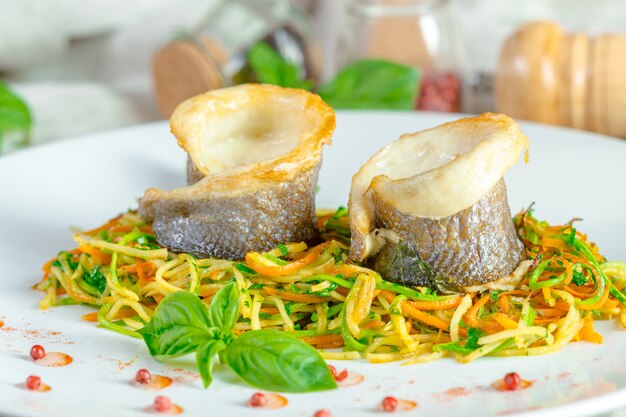  fried fish fillet and vegetables