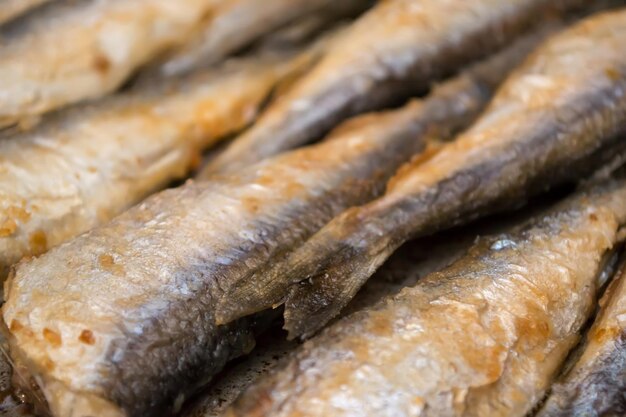 Fried fish herring Fried fish in a frying pan