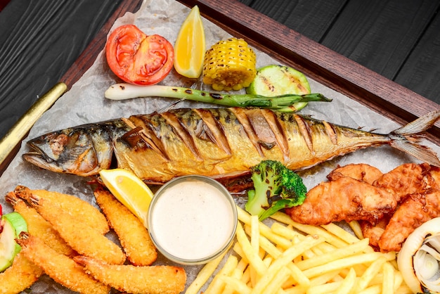 Fried fish, mussels, and shrimp with potatoes