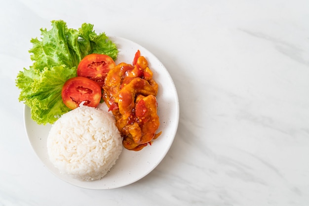 Fried fish topped by three flavors of chili sauce with rice