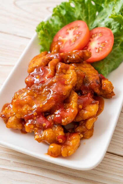 Fried fish topped with chili sauce