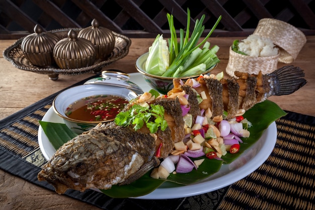 fried fish with herb and spicy sauce