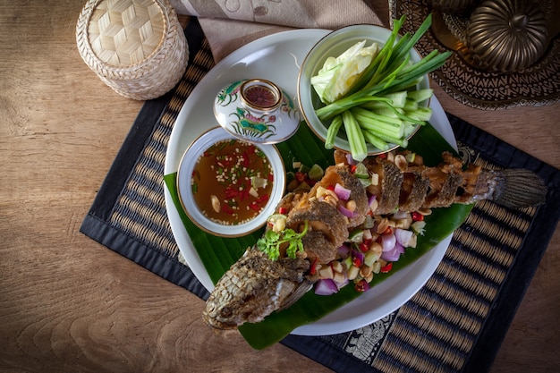 fried fish with herb and spicy sauce