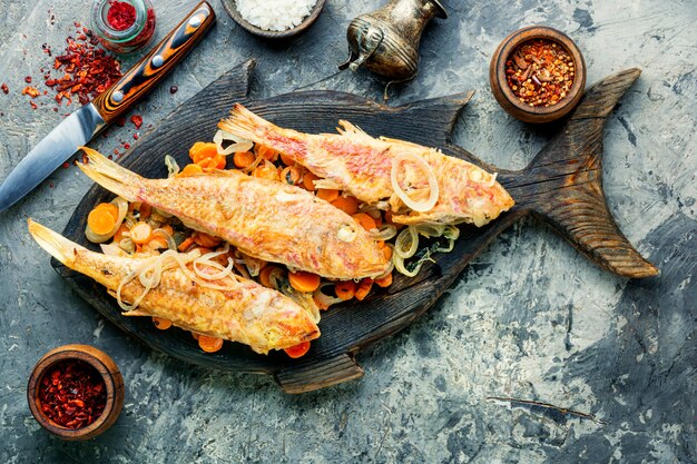 Fried fish with horseradish roots