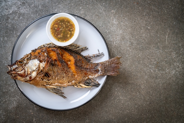 Fried fish with spicy seafood sauce