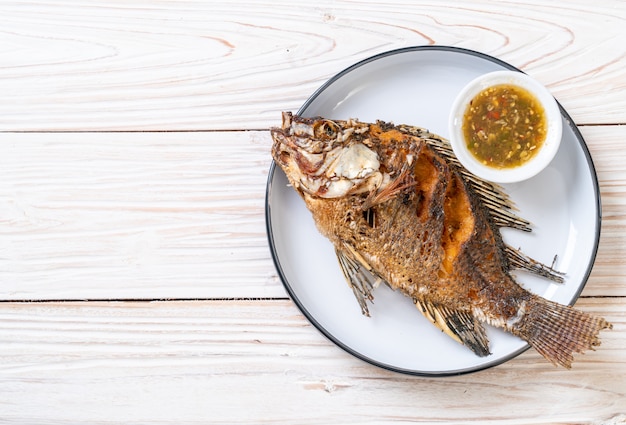 Fried fish with spicy seafood sauce