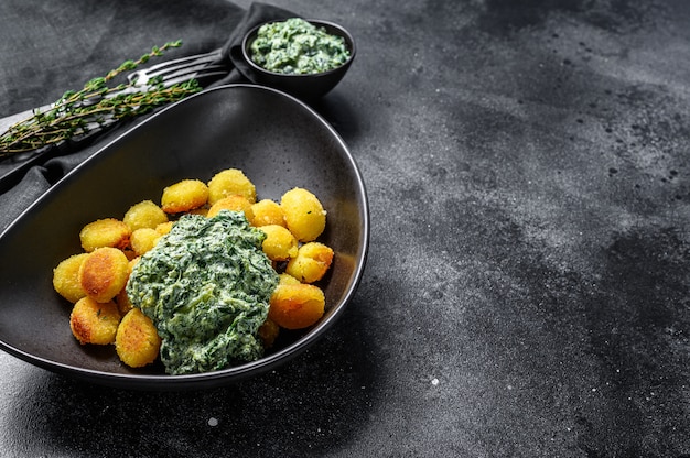 Fried gnocchi potato pasta with spinach