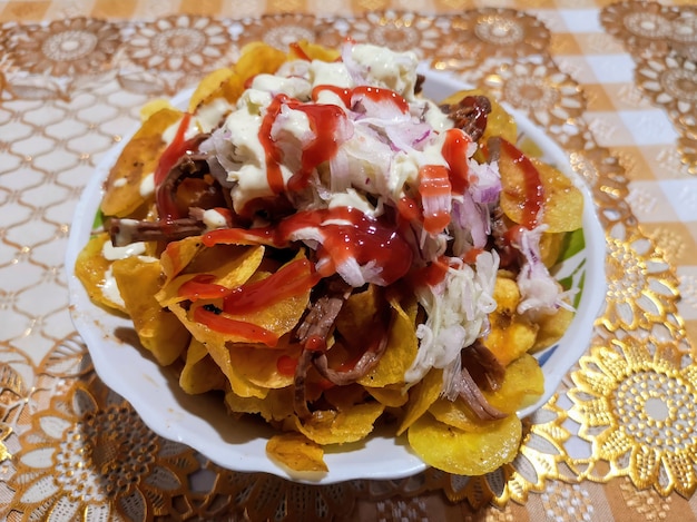 Fried green banana with mayonnaise onion and salad