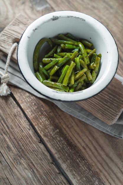 Fried green beans in a white bowl