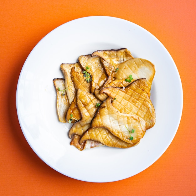 fried grill eryngii slice oyster mushroom king mushrooms eringi meal snack on the table copy space