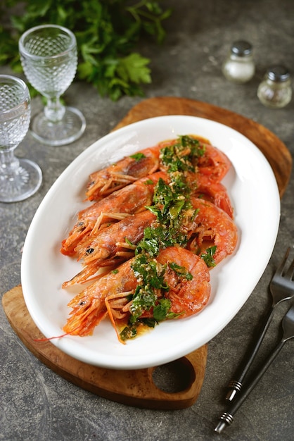 Fried large prawns with garlic, ginger and parsley