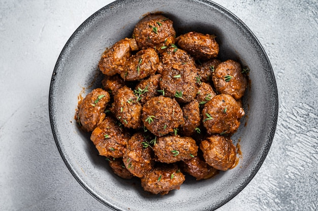 Fried Meatballs in tomato sauce from ground beef and pork meat