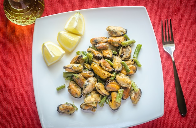 Fried mussels on the square plate