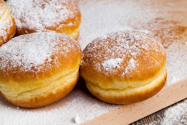 Fried in oil Berlin donuts with stuffing dessert of delicious and sweet donuts with stuffing