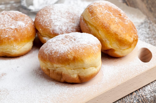 Fried in oil Berlin donuts with stuffing dessert of delicious and sweet donuts with stuffing