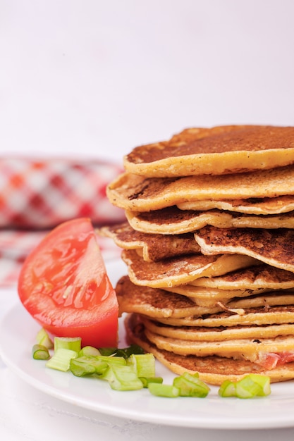 Fried pancakes or pancakes are stacked, appetizing appetizer for pancake week