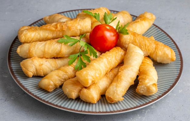 Fried pastry wrapped in cheese in phyllo. Pie in the form of a roll. Turkish name; Kalem borek - sigara boregi