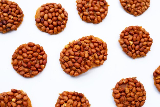 Fried peanut cookies on white background.