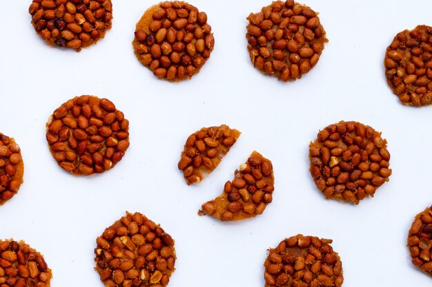 Fried peanut cookies on white background.