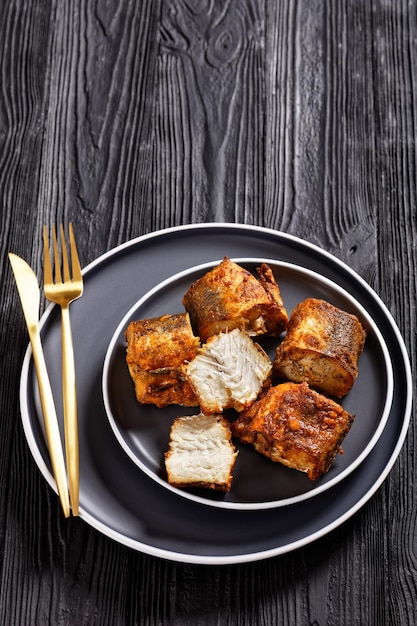 Fried pieces of hake on a plate