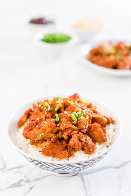 fried pork with spicy korean sauce (bulgogi) on top rice