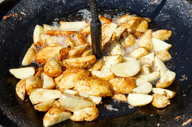 Fried potato in oil prepared in a bowl