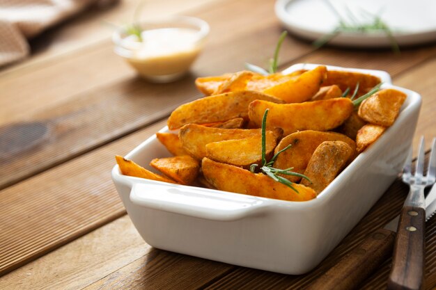 Fried potato with herbs and sauce