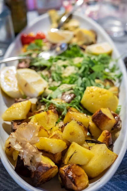 Fried potatoes in the oven. Delicious food. Fry. Grill. Kitchen.