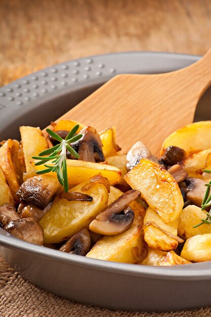 Fried potatoes with mushrooms and onions