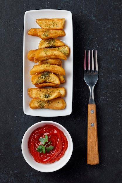 Fried potatoes with salt, parsley, and rosemary