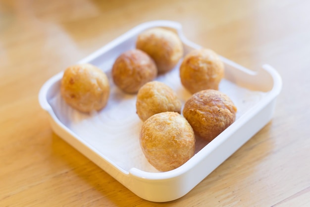 Fried premium shrimp ball made from fresh shrimp suitable to be served with noodles on a white plate
