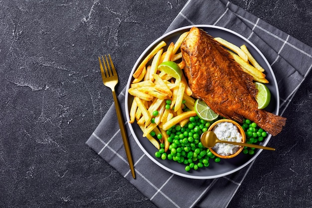 Fried redfish with chips green peas tartar sauce