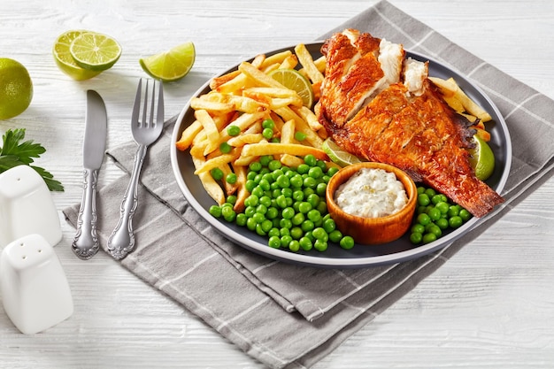 Fried redfish with chips green peas tartar sauce