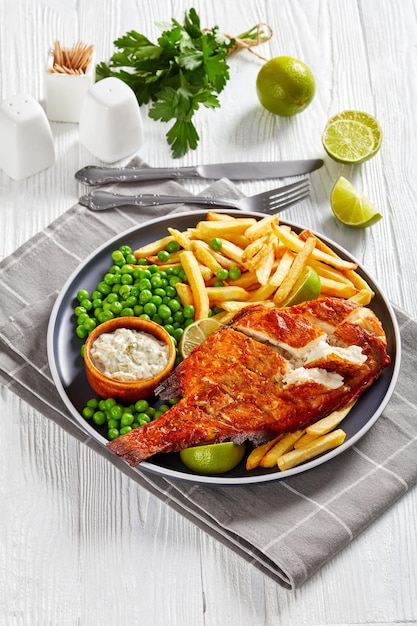 Fried redfish with chips green peas tartar sauce