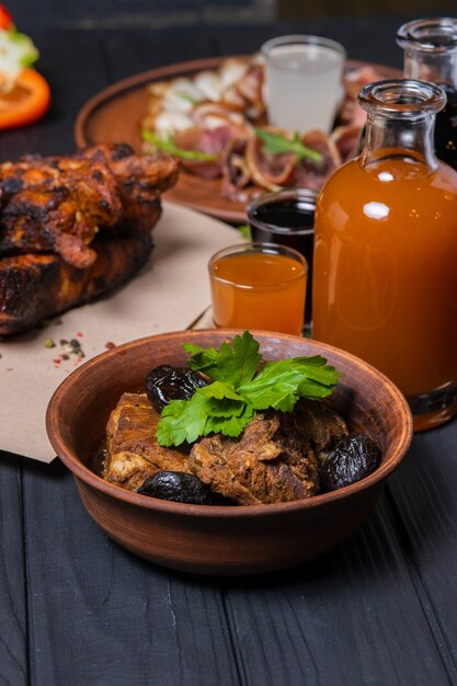 Fried ribs with pepper and bottle of wine