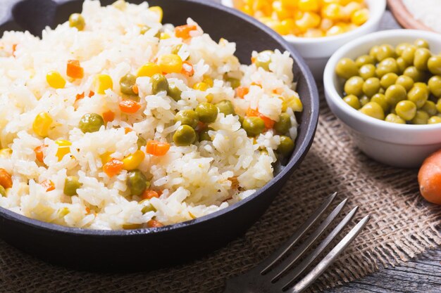 fried rice in pan on wooden background