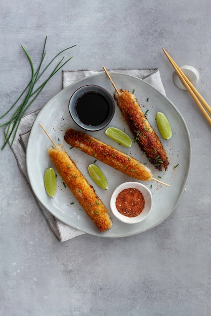 Fried rice skewers with prawns and teriyaki sauce. top view