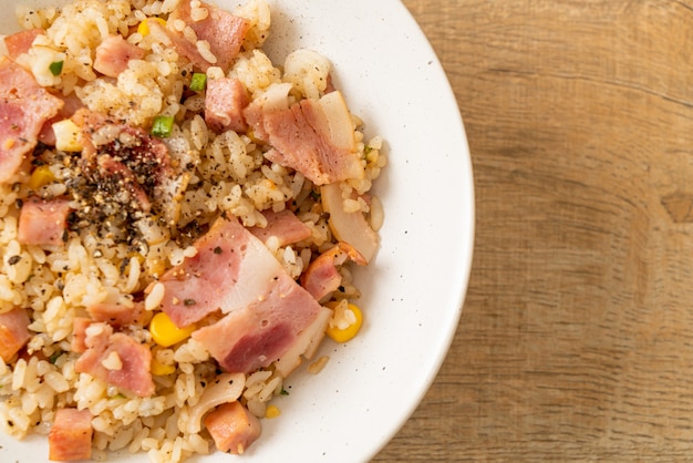 Fried rice with bacon ham and black peppers bowl