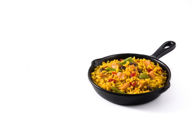 Fried rice with chicken and vegetables on frying iron pan isolated copy space