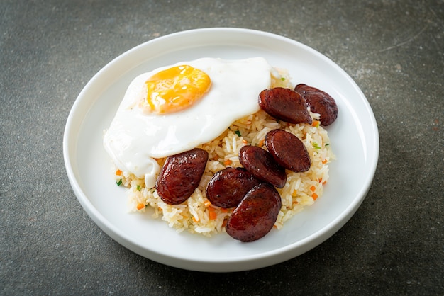 fried rice with fried egg and Chinese sausage - Homemade food in Asian style