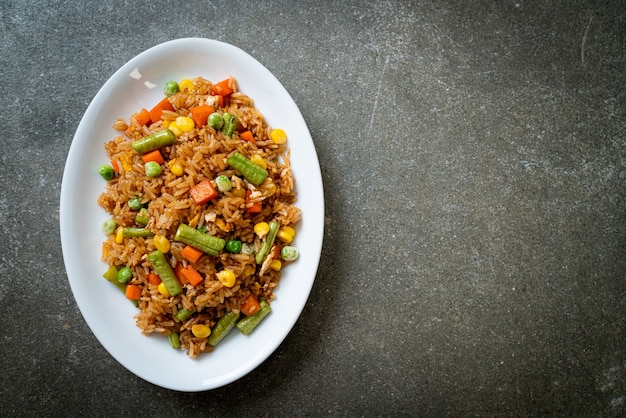 fried rice with green peas, carrot and corn - vegetarian and healthy food style