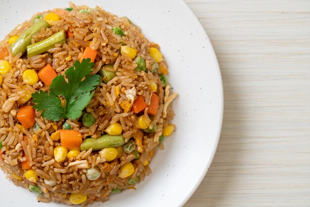 fried rice with green peas, carrot and corn - vegetarian and healthy food style