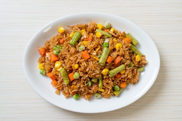 fried rice with green peas, carrot and corn - vegetarian and healthy food style