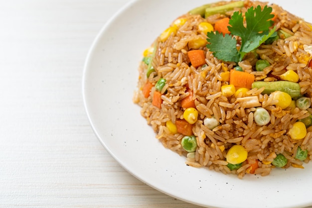 fried rice with green peas, carrot and corn - vegetarian and healthy food style