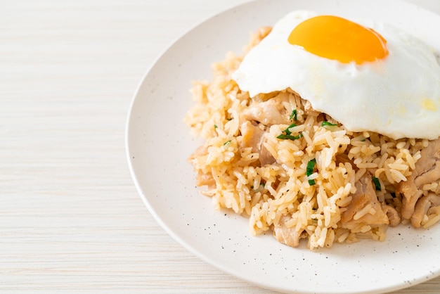 fried rice with pork and fried egg in Japanese style - Asian food style