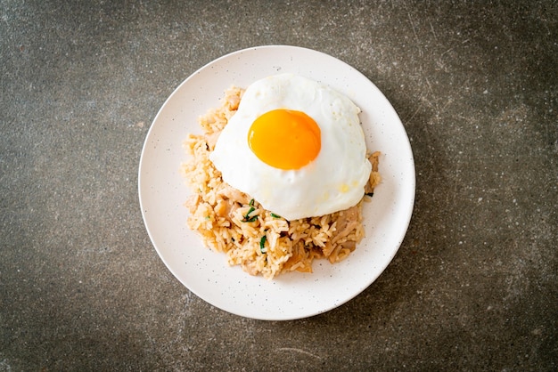fried rice with pork and fried egg in japanese style asian food style