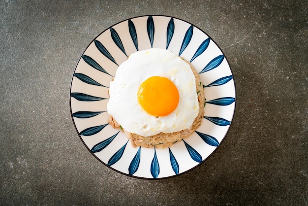 Fried rice with pork and fried egg in Japanese style