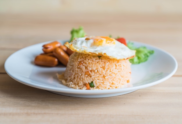 fried rice with sausage and fried egg