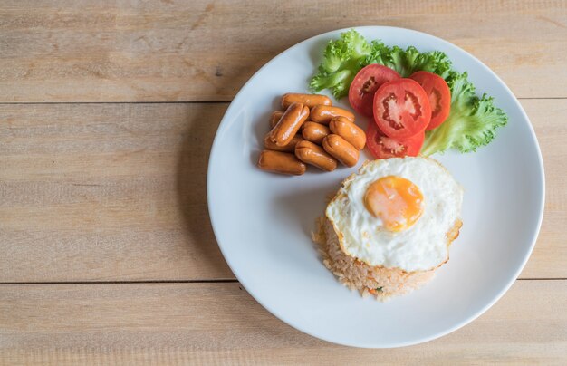 fried rice with sausage and fried egg