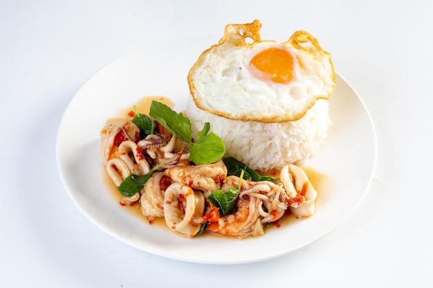 Fried Rice with Seafood and Basil isolated on white background